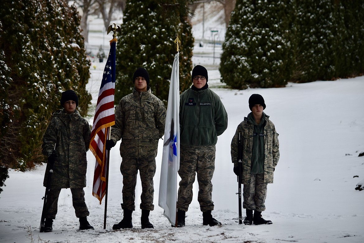 Cadets of the Civil Air Patrol’s Columbia Basin Composite Squadron stand ready to enter with the colors at the Ephrata Cemetery on Saturday in preparation for the Wreaths Across America ceremony.