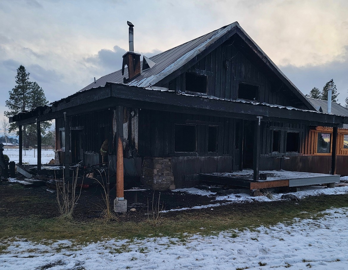 A house on Helena Flats Road is considered a complete loss after sustaining severe damage from a fire on Sunday, Dec. 19, 2021. (Photo provided by Evergreen Fire Department)