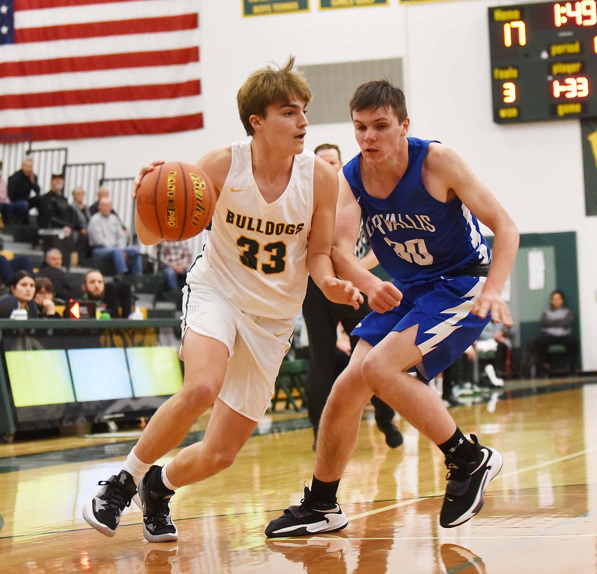 Whitefish’s Gabe Lund drives to the hoop against Corvallis Friday night at the Dawg Pound. (Heidi Desch/Whitefish Pilot)