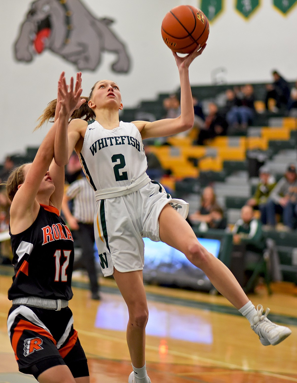 Whitefish senior Erin Wilde shoots over Ronan's Olivia Heiner in a game against the Maidens on Thursday. (Whitney England/Whitefish Pilot)