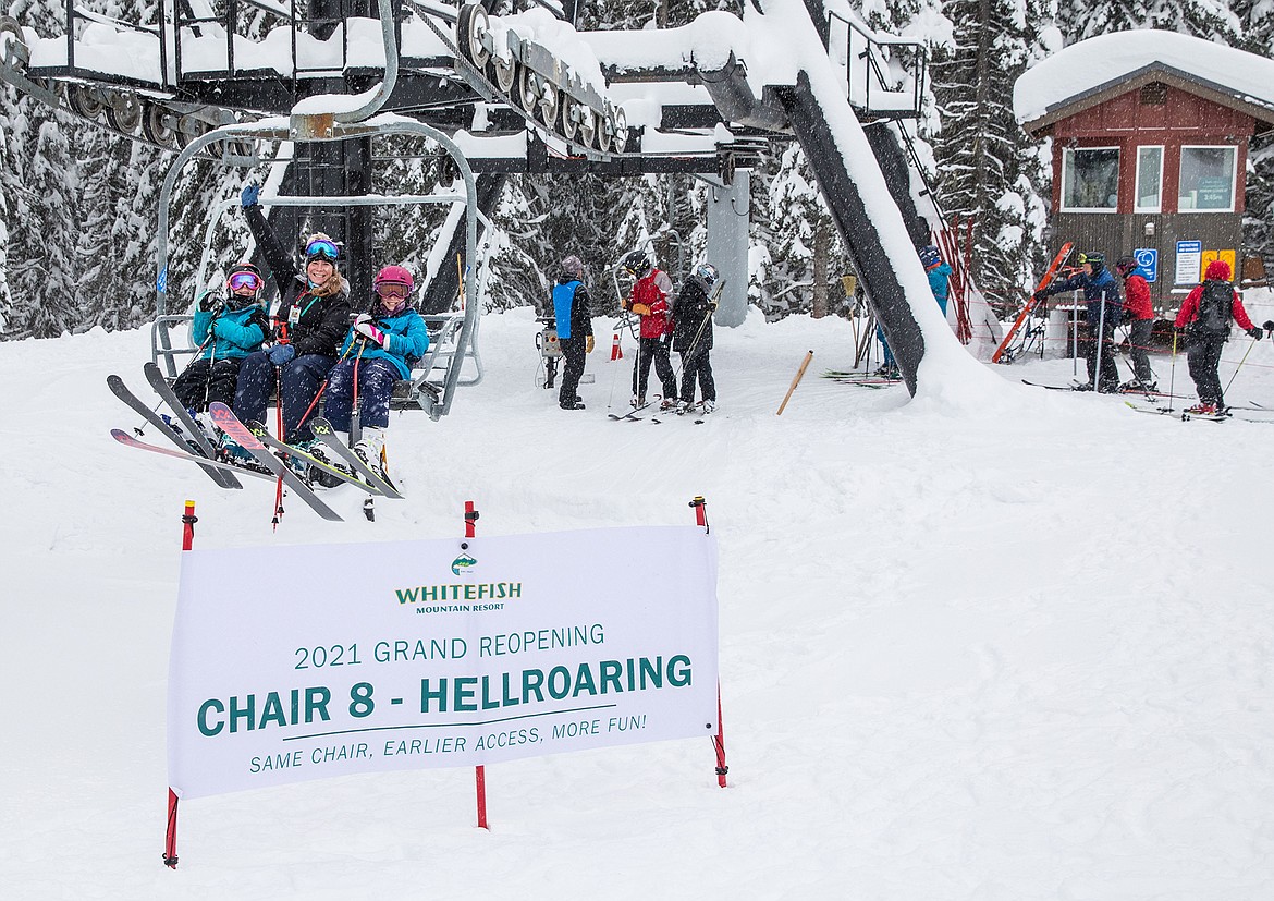 Cassey Heitz, daughter of the late Jack Marcial,  and her daughters Cadence and Evie catch a ride on Chair 8 at Whitefish Mountain Resort on Saturday. (Photo by GlacierWorld.com)