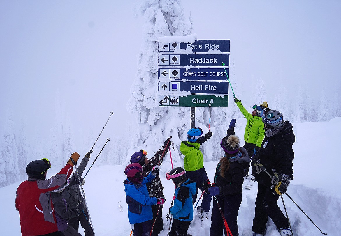Members of the Marcial family pose at the top of RadJack, a new run in the Hellroaring Basin named in honor of the late Jack Marcial. (Photo by Whitefish Mountain Resort)