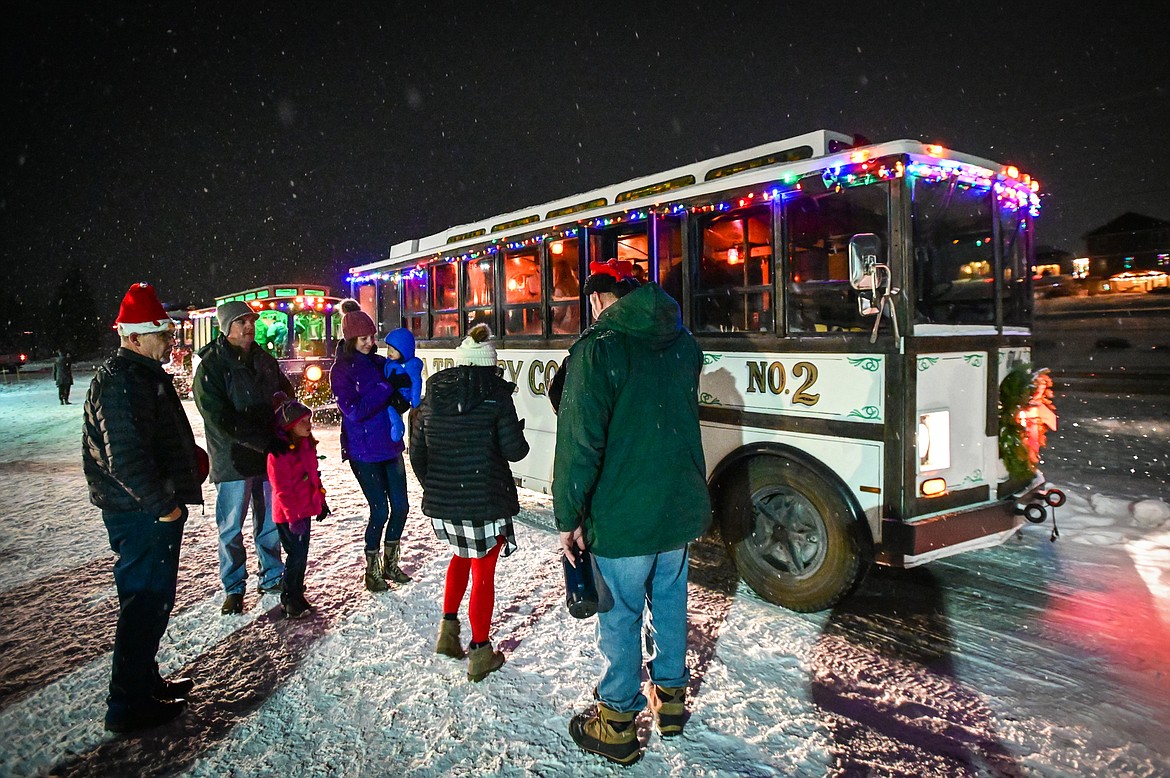 Visitors board a Montana Trolley Co. bus at the live nativity at Family Life Christian Church on Saturday, Dec. 18. (Casey Kreider/Daily Inter Lake)