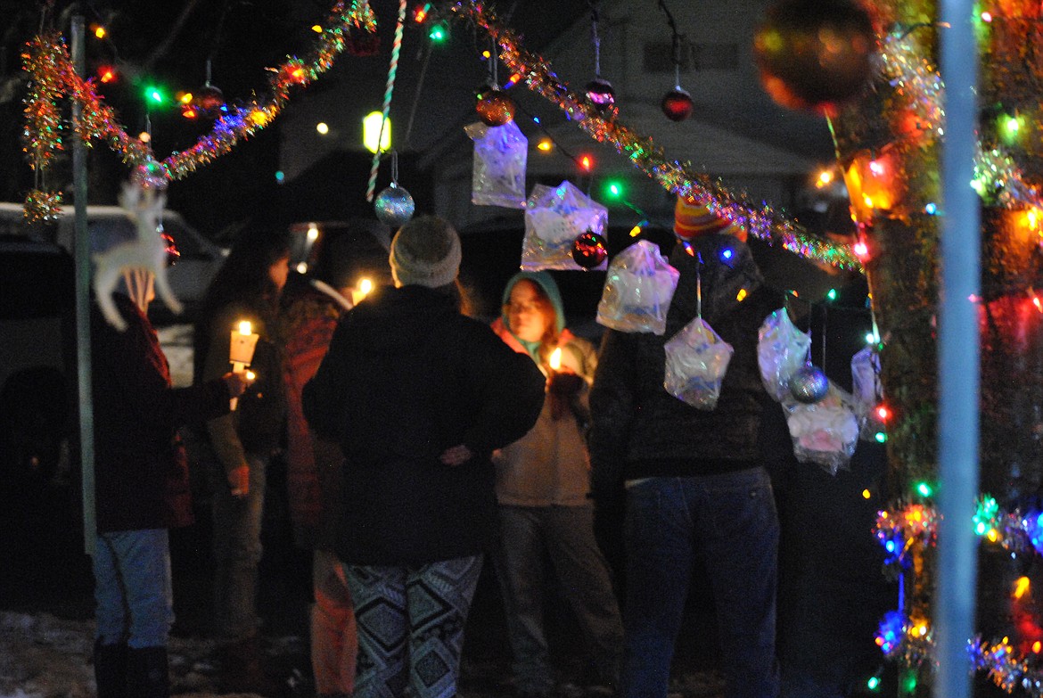 Community members gathered around Casey Ropers Memorial Tree at St. Regis School on Sunday December 12, to take part in the 25th Annual Compassionate Friends Worldwide Candle Lighting Ceremony. This tradition was brought to the town of St. Regis by Cathryn Briggs, Casey's mother. Over the years of honoring passed loved ones, Briggs has added her own special touches to the ceremony and has 12 angels dedicated hanging from the tree. (Amy Quinlivan/Mineral Independent)