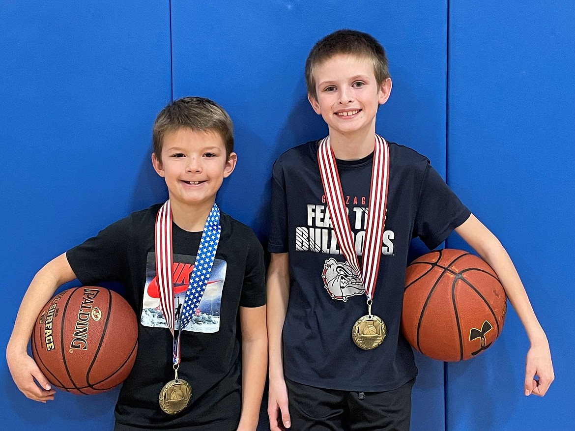 (left) Bradon Cartwright-Kissee and (right) Brydin Weymer won honors at the Elks free throw contest. Bradon took first place for the boys 8/9-year-old contest. Brydin was on top for the 10/11-year-old contest finishing with 16 made free throws. Bradon and Brydin both took first place in their age group at the regional competition in Sandpoint.