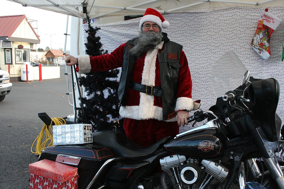 Ed Holland, also known as Wabbit, plays Santa at the Unchained Brotherhood MC fundraiser Dec. 11.