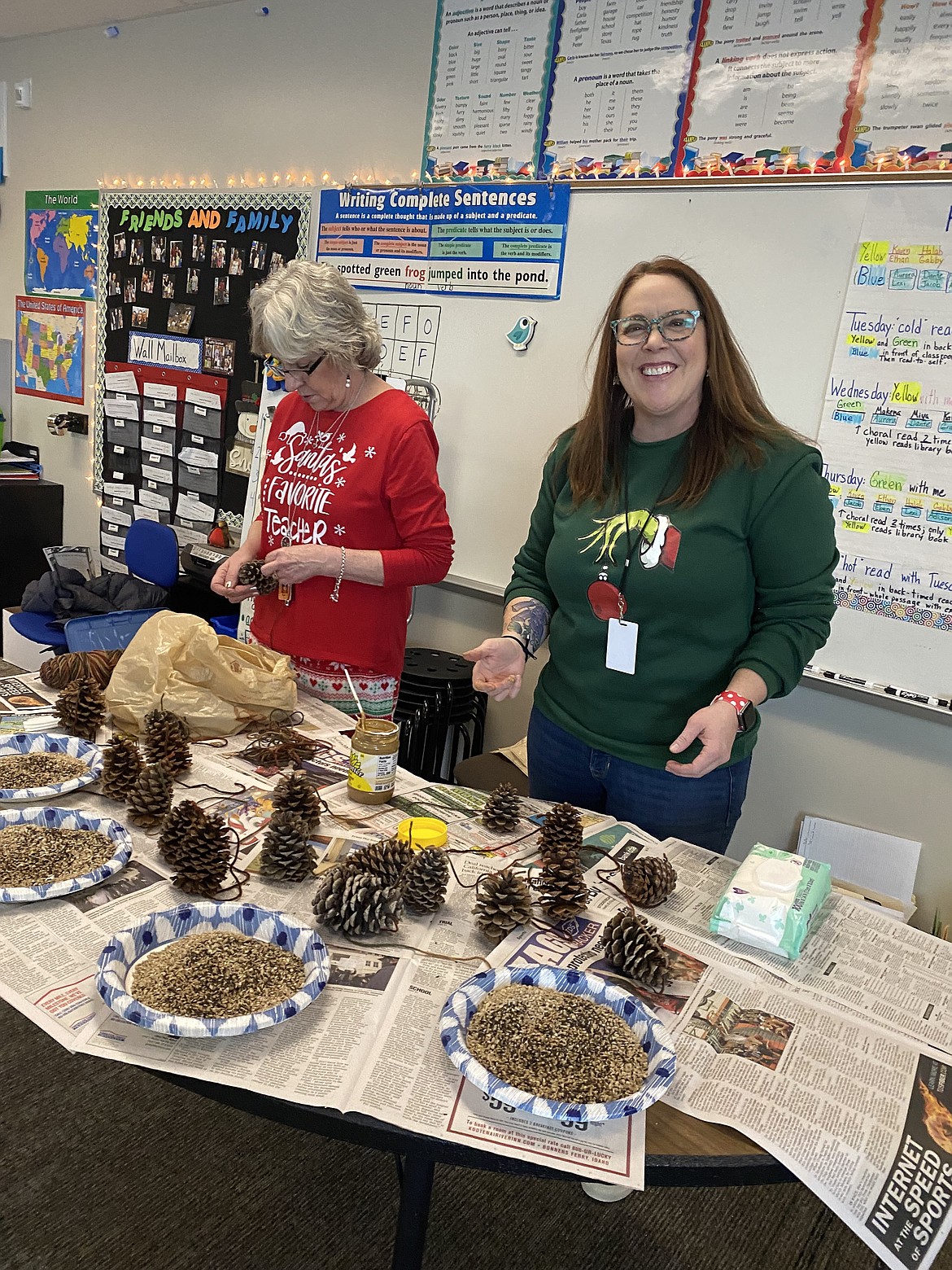 Third-grade teacher Mary Pattis and wild-life biologist Carrie Hugo prepare the craft station for Pattis' Treaty Rock students Friday as part of the Bureau of Wildlife Management's Bird by Bird program.