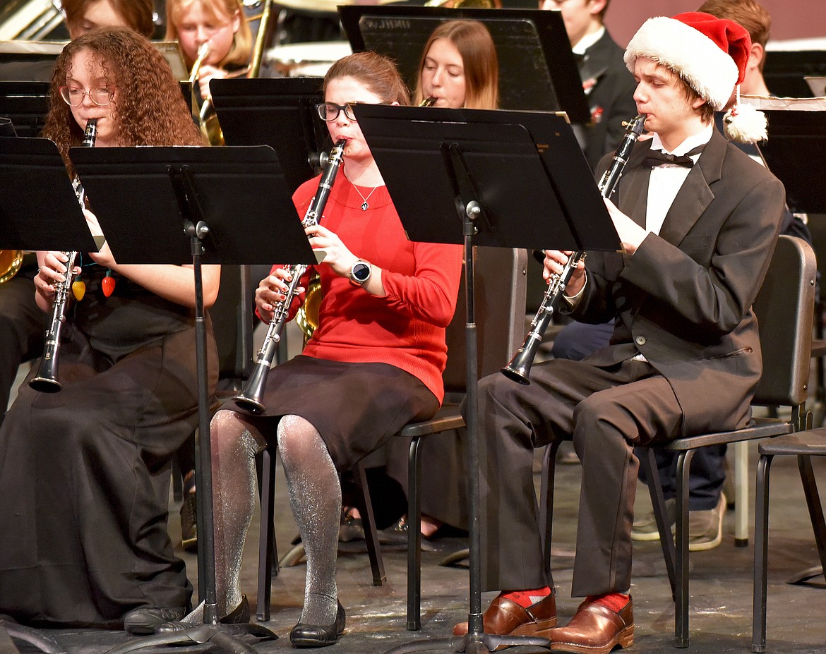 In a combined eighth grade and high school band performance, from left to right is Aliyah Malloy, Ella Idleman, and Brannan Beers on clarinet at the winter band concert on Dec. 9 at the Whitefish Performing Arts Center. (Whitney England/Whitefish Pilot)
