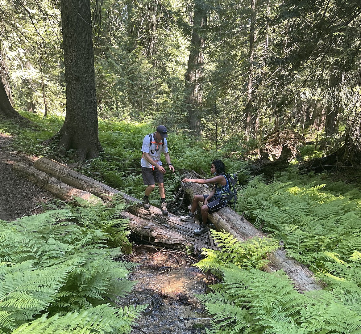Ben Scofield, Coeur d’Alene Tribe water resources specialist, and Jemari Peone, Climate Explorers intern, take a look at some macroinvertebrates in upper Hobo Creek in the St. Joe National Forest.