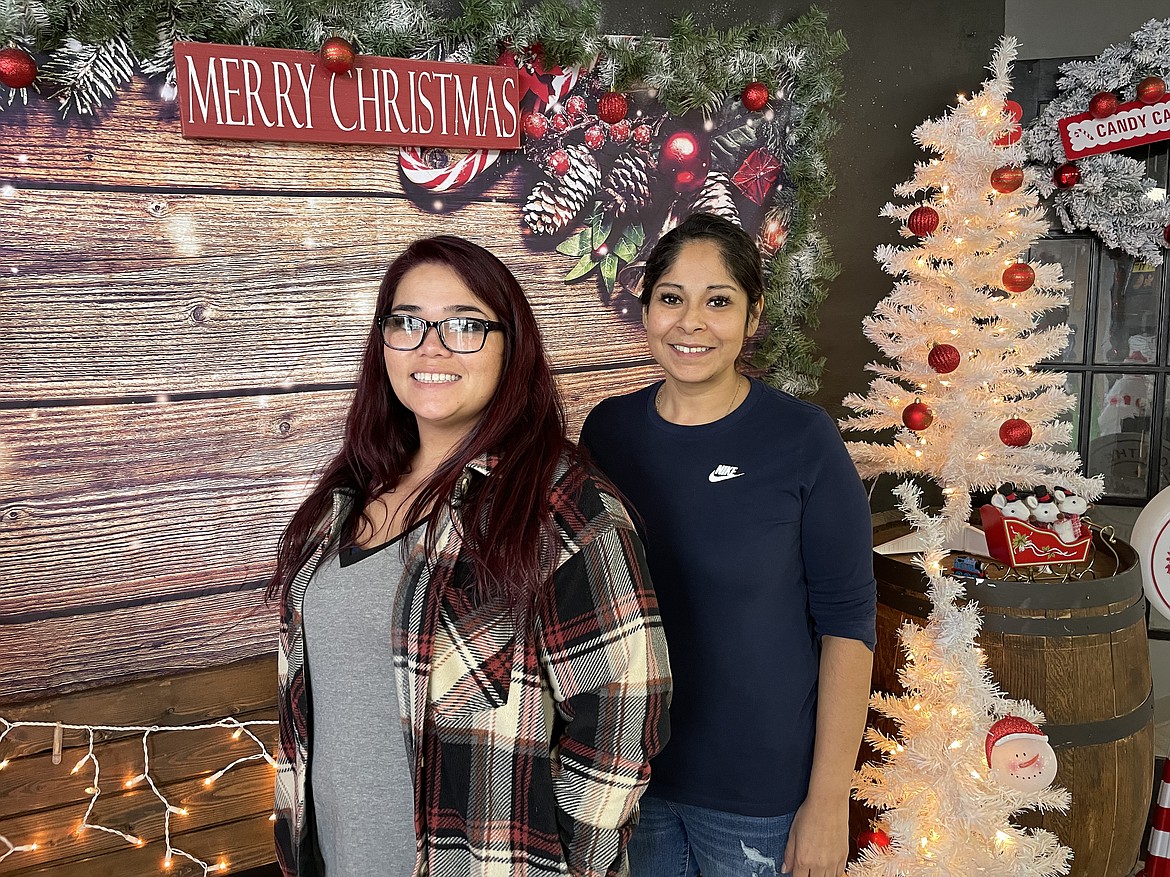 B’s Barbershop owners Shanna Berneski (left) and Belinda Alvarado won the best decorated business in this year’s Light Up Moses Lake competition.