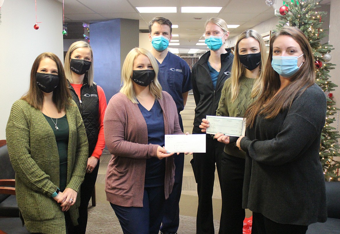 Members of the North Idaho Eye Institute team present a check for $2,000 to Children’s Village in Coeur d’Alene. Children’s Village is one of 17 local nonprofits that received part of a $30,000 gift from North Idaho Eye this holiday season. From left: North Idaho Eye Institute employees Jamie Shain, Alysse Craner, Sydnee Latuseck, Dr. Drew Thomas, Dr. Whitney Smith and Dr. Sara Duke; and Children’s Village CEO Vanessa Moos.