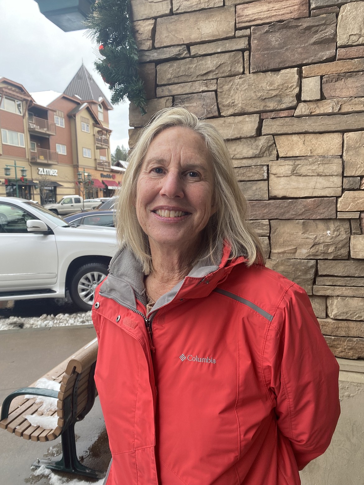 Harrison resident Deanne Miller waits for her husband Wednesday following a hair appointment in the Riverstone shopping area. As a newer arrival to Kootenai County, she hopes the hospitality and friendliness of North Idaho never change.
