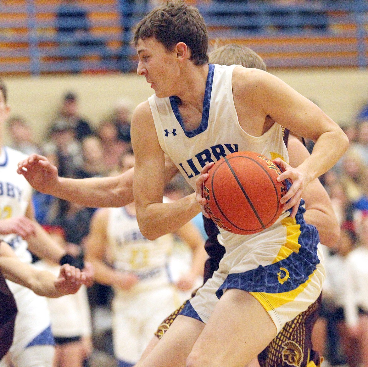 Senior forward TJ Andersen drives for the basket. He was fouled and went 1 for 2 from the line first quarter. The Libby Loggers beat the Troy Trojans 62-15. (Paul Sievers/The Western News)