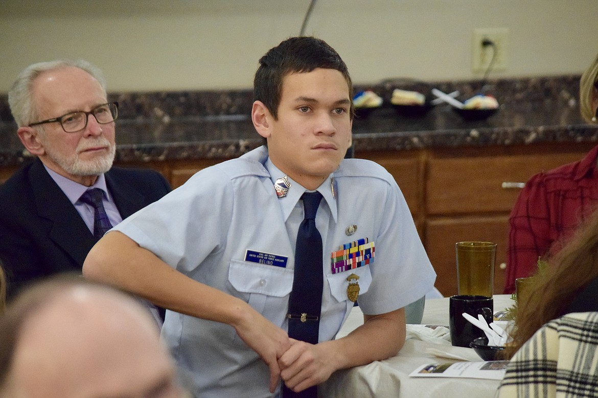 Civil Air Patrol Cadet Chief Master Sgt. Benjamin Belino listens intently during a ceremony and dinner Dec. 16 to mark the Civil Air Patrol’s 80th anniversary.