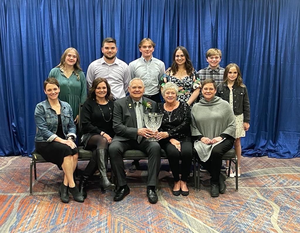 Courtesy photo
Longtime former Coeur d'Alene High athletic director Larry Schwenke poses with family after being inducted into the National Interscholastic Athletic Administrators Association Hall of Fame on Dec. 14 in Denver. Seated from left are daughters Andi Sadler and Ann Jaworski; Larry Schwenke, wife Laurie and daughter Keri Carter; and standing from left, grandchildren Bailey Jaworski, Cole Jaworski, Justin Jaworski, Julia Jaworski, Ian Sadler and Jaime Jaworski. Not pictured is grandson Aaron Sadler, who was at a CHS band concert.