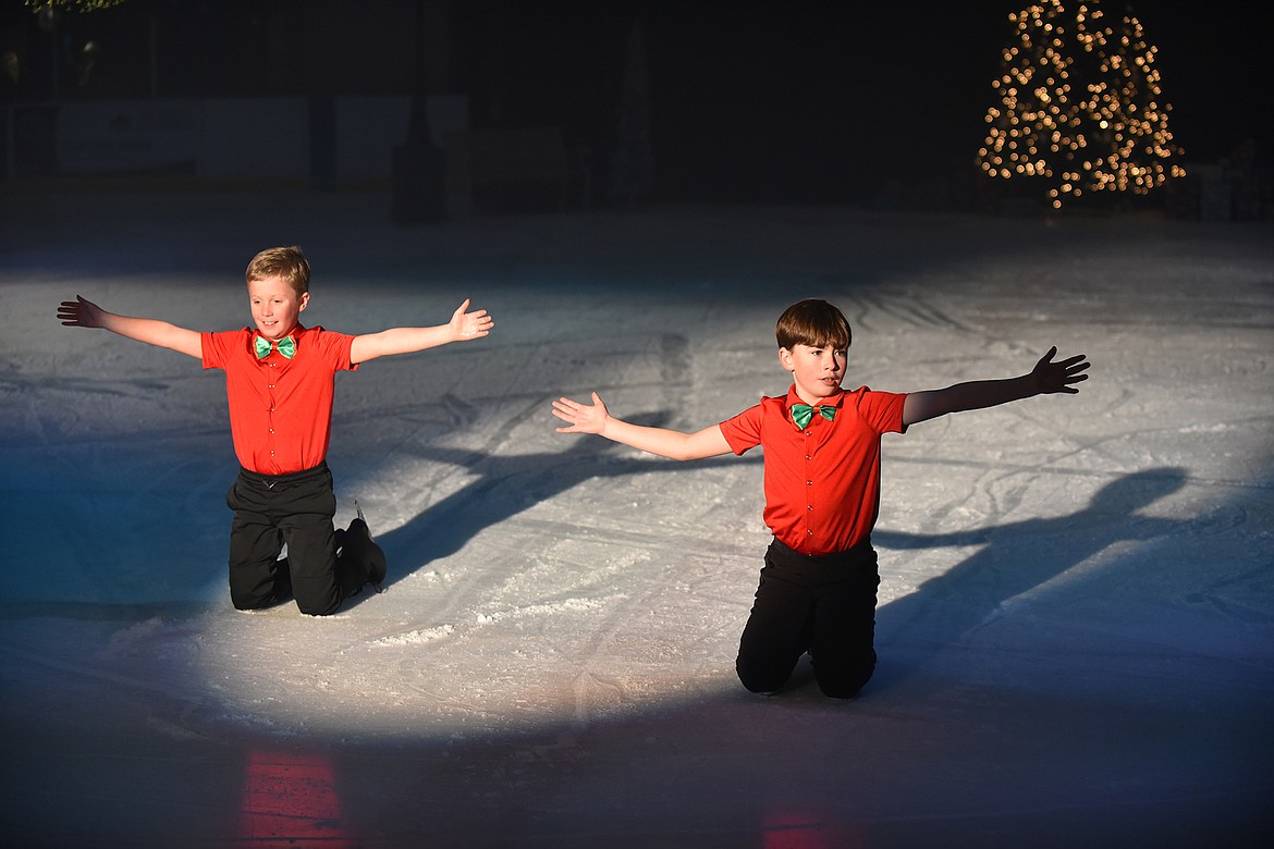 Finn Irwin and Barrett Heslop end their performance during the Glacier Skate Academy’s recent Christmas on Ice show. (Heidi Desch/Whitefish Pilot)