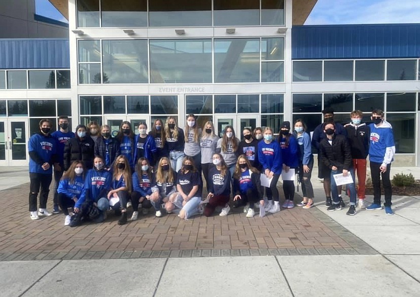 In this Feb. 3 photo, Coeur d’Alene High School and Lake City High School student council and ASB officers posed outside the V at CHS after dropping off donations from the All for AWL drive to local community centers including the Union Gospel Mission and Saint Vincent De Paul. Courtesy photo