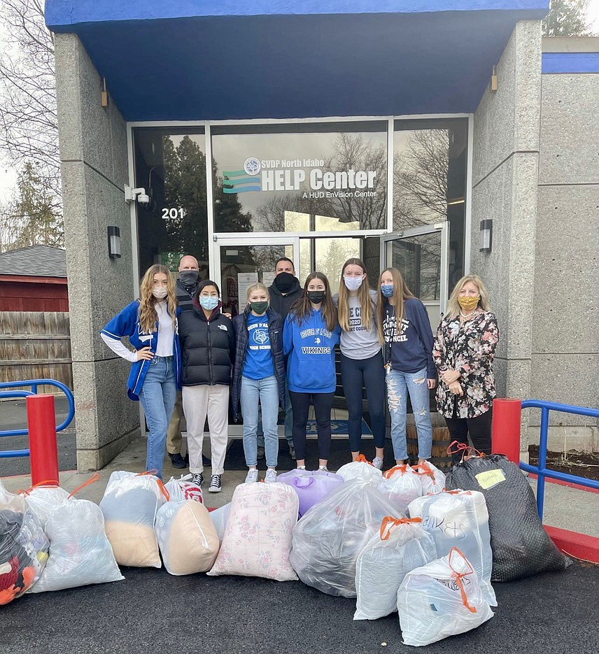 From left, Coeur d’Alene High School students Myah Rietze, Sophia Allen, Maddi Cleave and Amy Corette along with Lake City High School students Hanah Stoddard and Kendall Pickford outside of the Saint Vincent De Paul North Idaho Help Center on Feb. 3rd. The students dropped off blankets, sleeping bags and fleece materials donated by both high schools and the community through the schools' All for AWL campaign. Courtesy photo