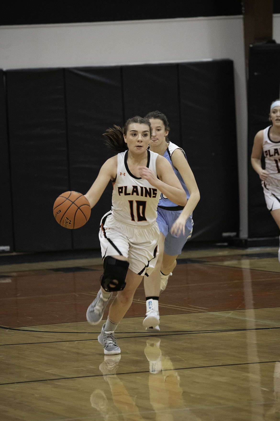 Calie Wagnor takes the ball up the court against Bigfork. (Tracy Scott/Valley Press)