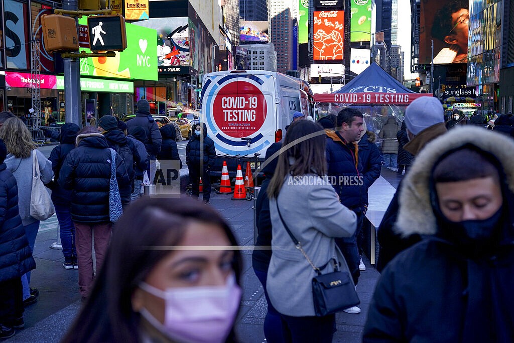 People wait in a long line to get tested for COVID-19 in Times Square, New York, Dec. 20, 2021. U.S. health officials' decision to shorten the recommended COVID-19 isolation and quarantine period from 10 days to five is drawing criticism from some medical experts and could create confusion among many Americans. (AP Photo/Seth Wenig, file)