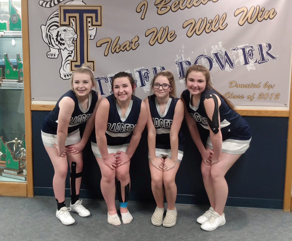 Addy Heigel, Hailey Kelsey, Brenna Stewart and Gena Kelsey of the Cheer team after the Timberlake Invitational on Feb. 20.