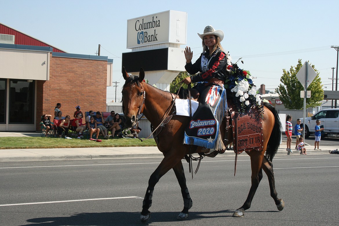 Brianna Kin Kade waves to the crowd during the 2021 Independence Day parade in Othello. Kin Kade was the 2020-21 Othello Rodeo queen, and she was selected as the 2022 Moses Lake Roundup queen in November.