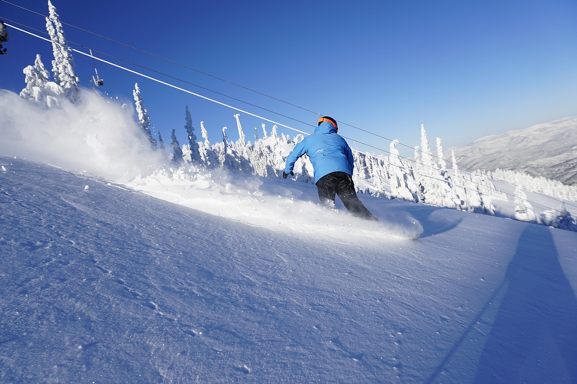 A snowboarder takes a run near Chair 4 at Silver Mountain Resort in Kellogg. Photo courtesy of Silver Mountain Resort