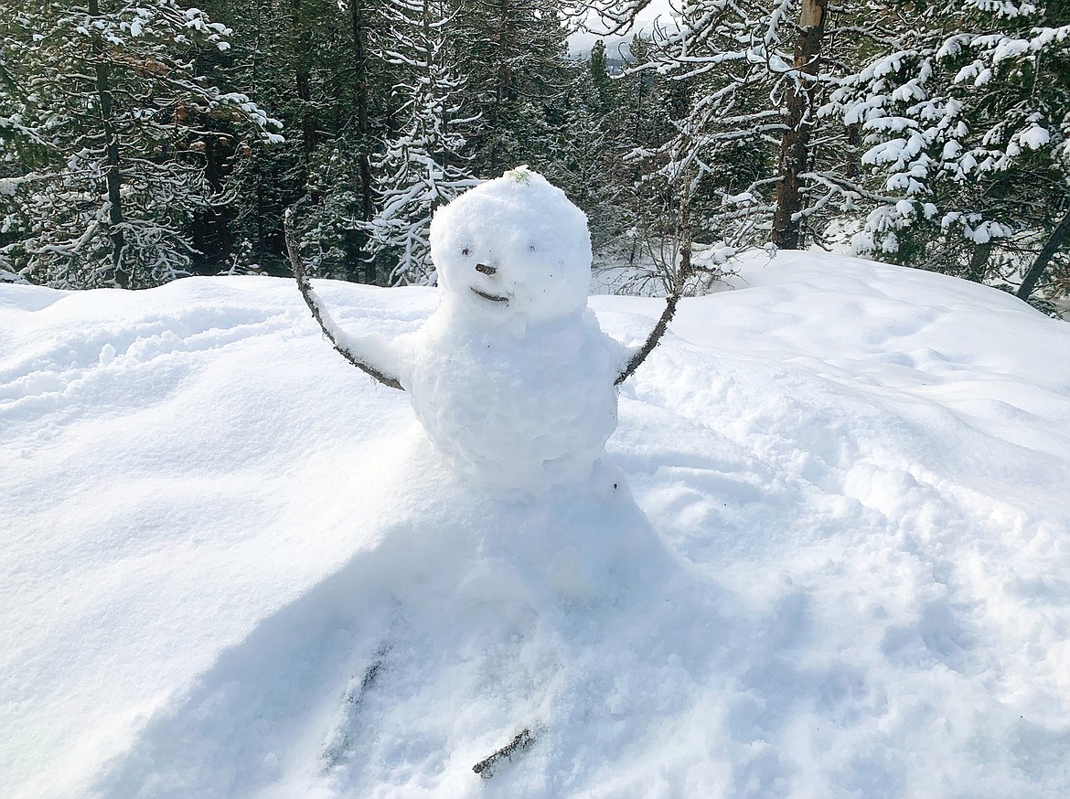 A snowman greets guest at the top of Tubbs Hill on Sunday.