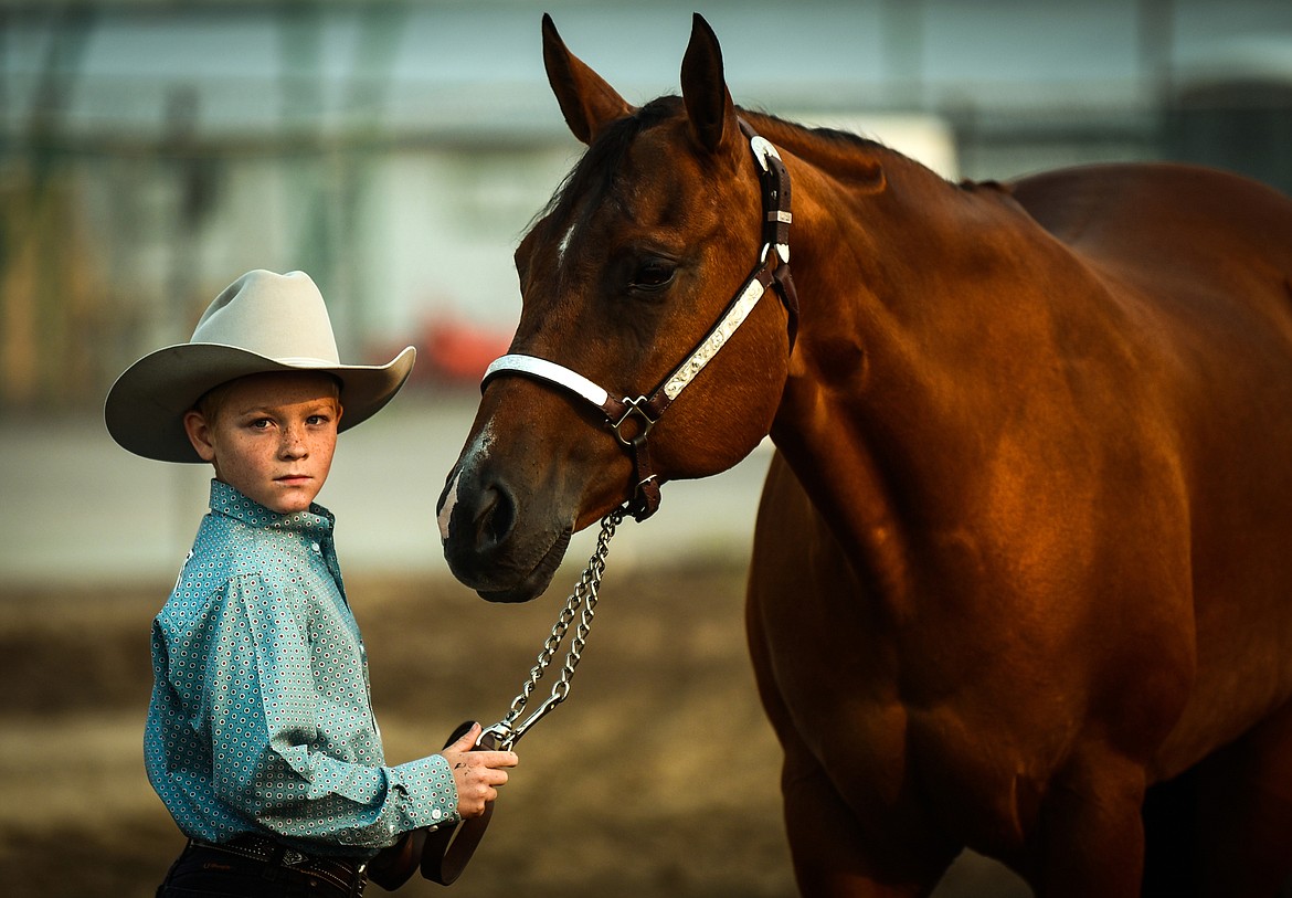 Kiel Guffin stands with his horse Ivy during pre-junior level Showmanship at the 4-H Horse Show at the Northwest Montana Fair on Saturday, Aug. 14. (Casey Kreider/Daily Inter Lake)