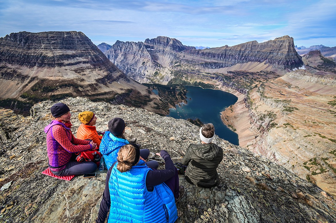Hikers rest on a ledge over Hidden Lake on the Dragon's Tail in Glacier National Park on Friday, Oct. 8. (Casey Kreider/Daily Inter Lake)