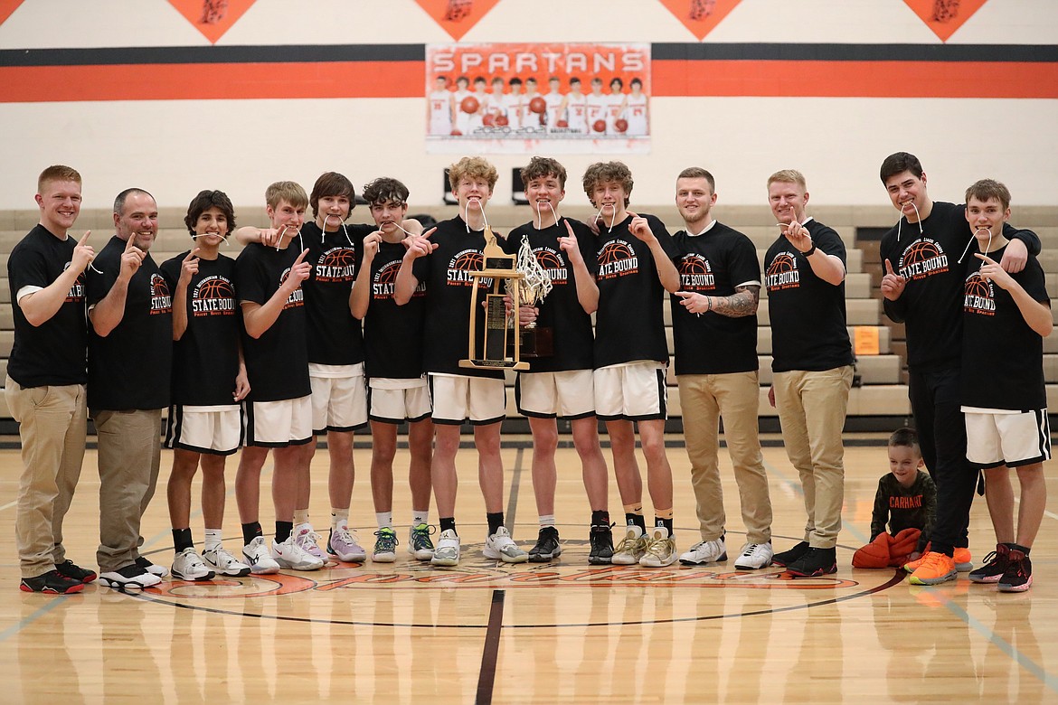 The Priest River boys basketball team celebrates this past winter after cutting down the nets and claiming their first 3A District 1 title since 2011.