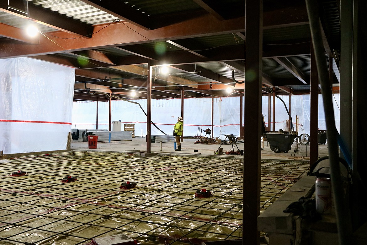 Construction worker Ken Sheets walks across the bottom story of the expansion on the Meyer Health and Science building on Dec. 29. The project is scheduled to be completed in fall. HANNAH NEFF/Press