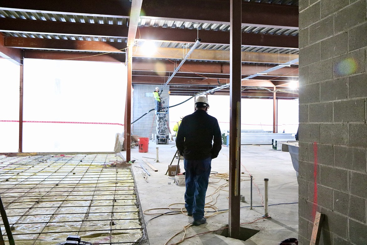 Garry Stark, director of facilities operations for NIC, walks across the bottom story of the Meyer Health and Science building expansion on Dec. 29. HANNAH NEFF/Press