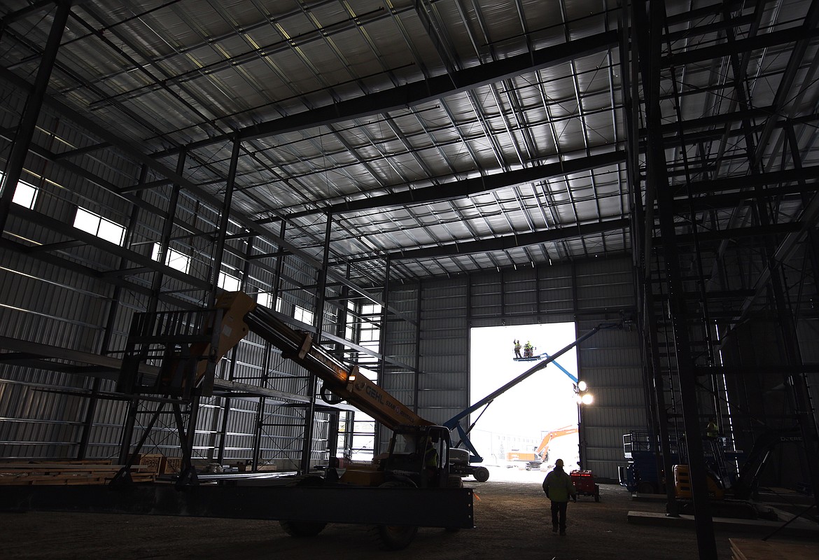 Light shines through an opening of the Hagadone Marine Group's Quick Launch boat facility under construction Thursday.