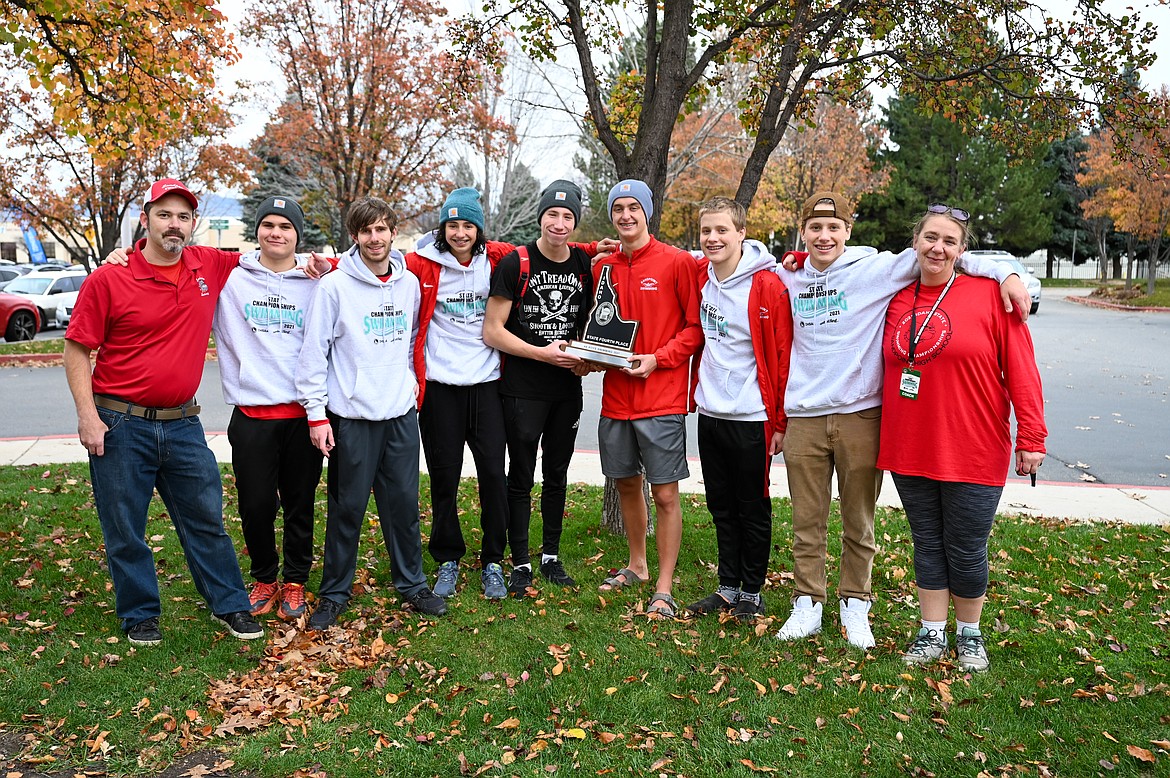 The Sandpoint boys swim team poses for a photo after capturing the fourth-place trophy at the 4A state swim meet.