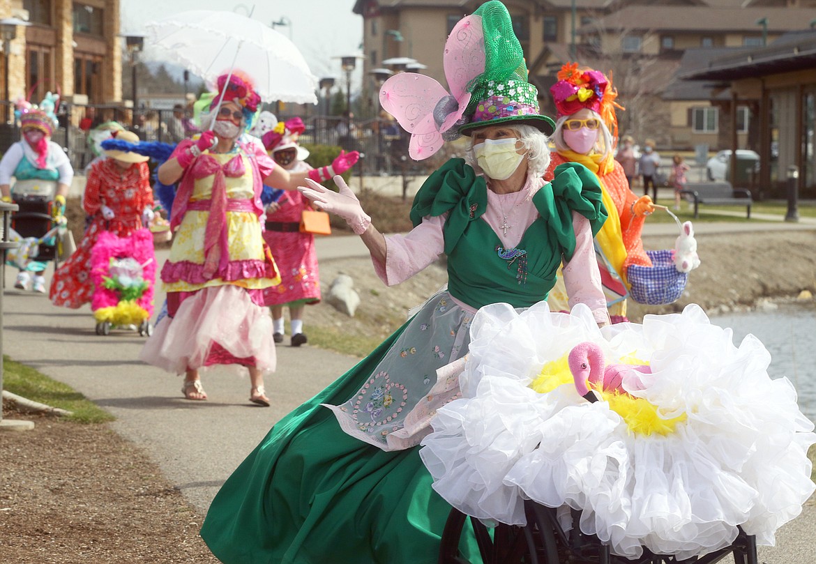 Mikki Stevens leads The Red Hot Mamas flash parade before Easter at Riverstone.