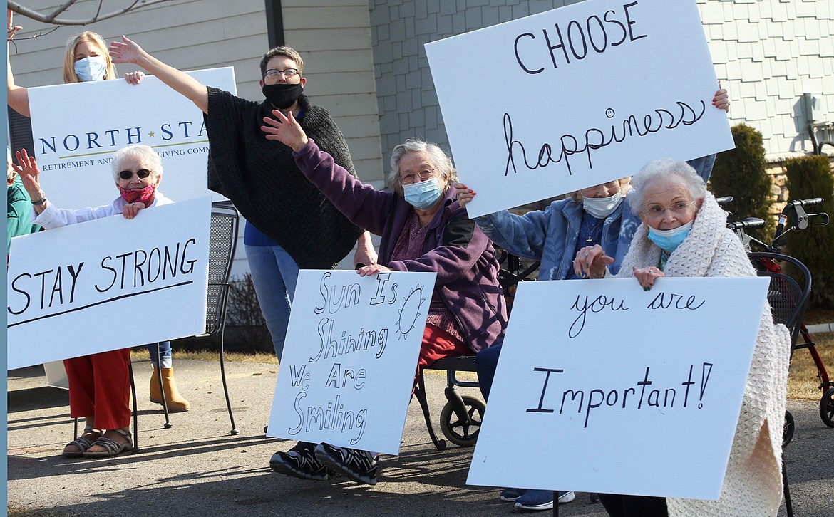 North Star Retirement and Assisted Living Community residents join a March 12 rally on Seltice Way to spread good will. Sitting, from left, are Shirley Vance, AdaMay Foster, Dorothy Morey and Dottie Hodgson.