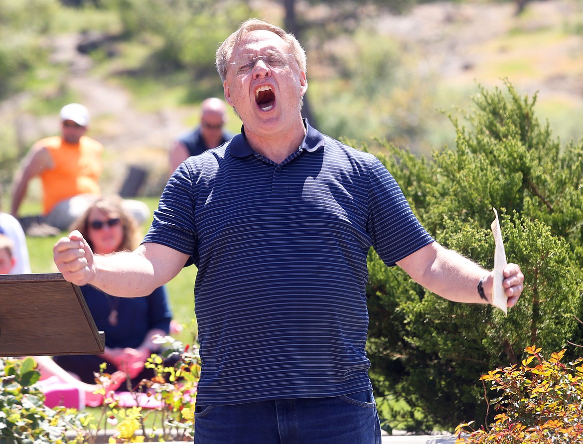 Pastor Brock Hoyer of Journey of Hope shouts during his prayers at the National Day of Prayer gathering in Coeur d'Alene on May 6.