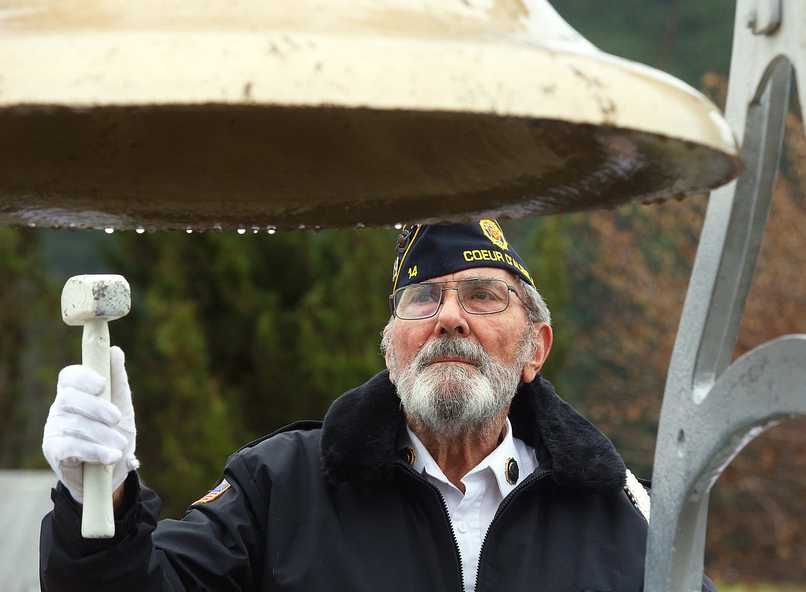 Charles Riffel rings the bell at the Tomb of the Unknown Soldier at McEuen Park during a Veterans Day ceremony on Veterans Day.