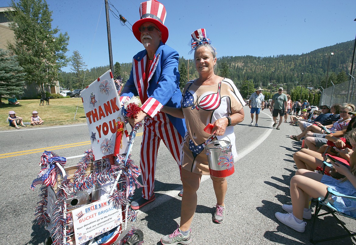 Jamie Berube and Bob Prince were “Uncle Sam’s Bucket Brigade” on July 3 at the Bayview Daze parade.