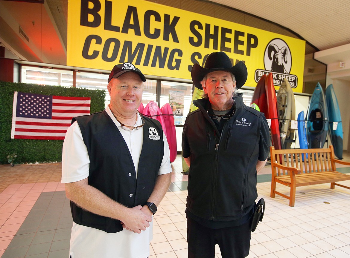 Brian Knoll, left, and Dave Knoll stand in front of the new home for Black Sheep Sporting Goods at the Silver Lake Mall in mid-October.