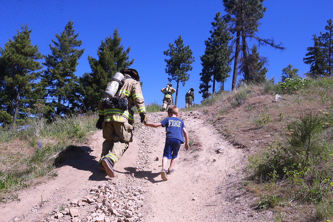 Kelan McKiernan and son Maddex hike up Canfield Mountain together on May 15 during a fundraiser for the Leukemia & Lymphoma Society.