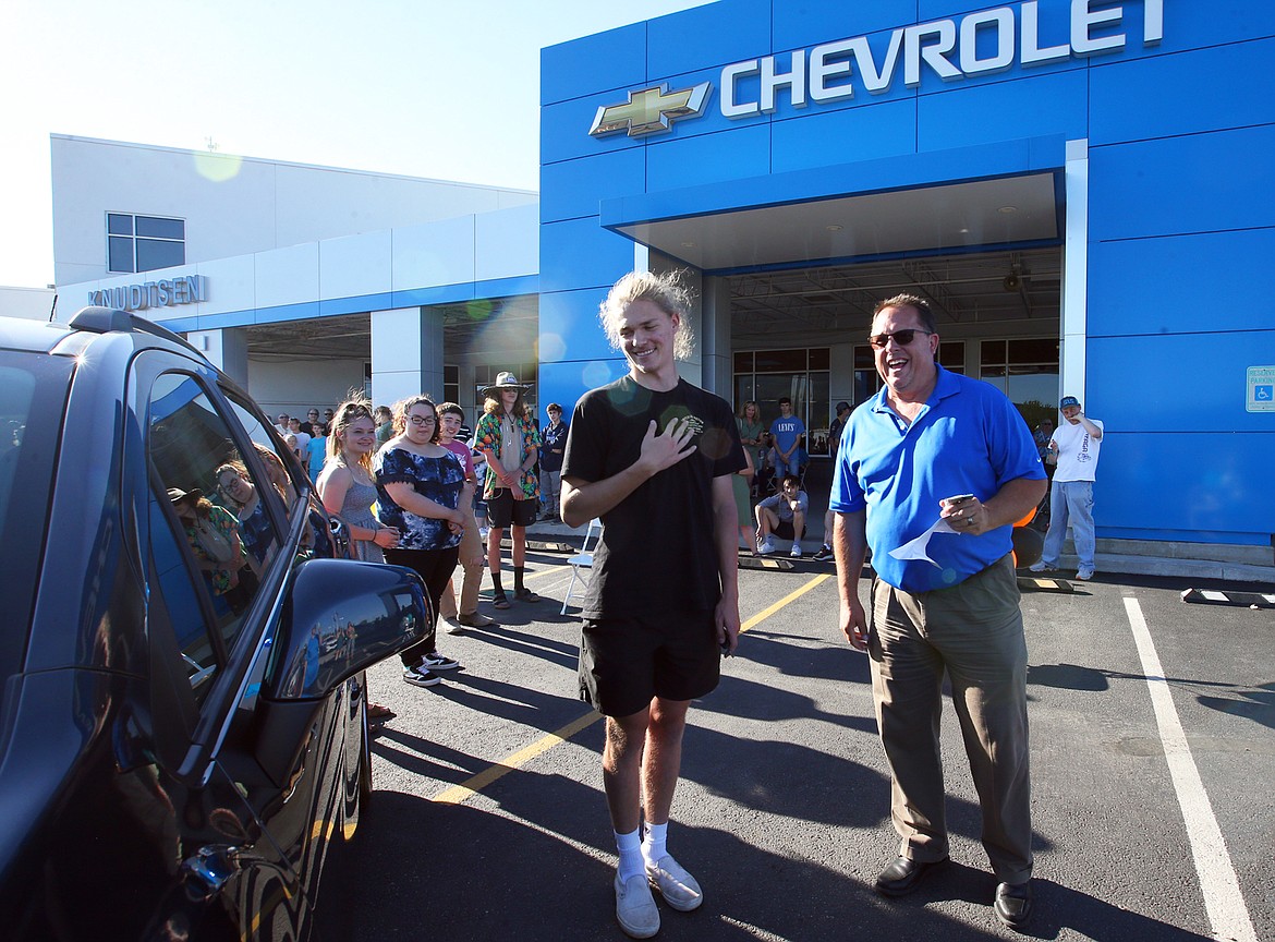 Dustan Zirbel reacts to winning the 2021 Chevy Trax as Knudtsen Chevrolet Executive Manager and Co-owner Eric Knudtsen readies to hand him the keys in June. For the eighth year, to celebrate and congratulate graduating seniors, Knudtsen Chevrolet gave away a vehicle.