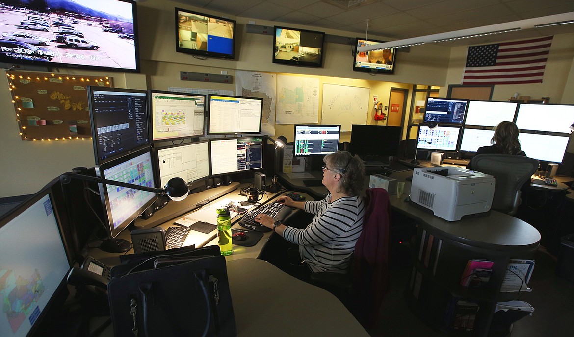 Mary Conrad, emergency communications officer, works at the Idaho State Police Regional Communication Center in Coeur d'Alene in April.