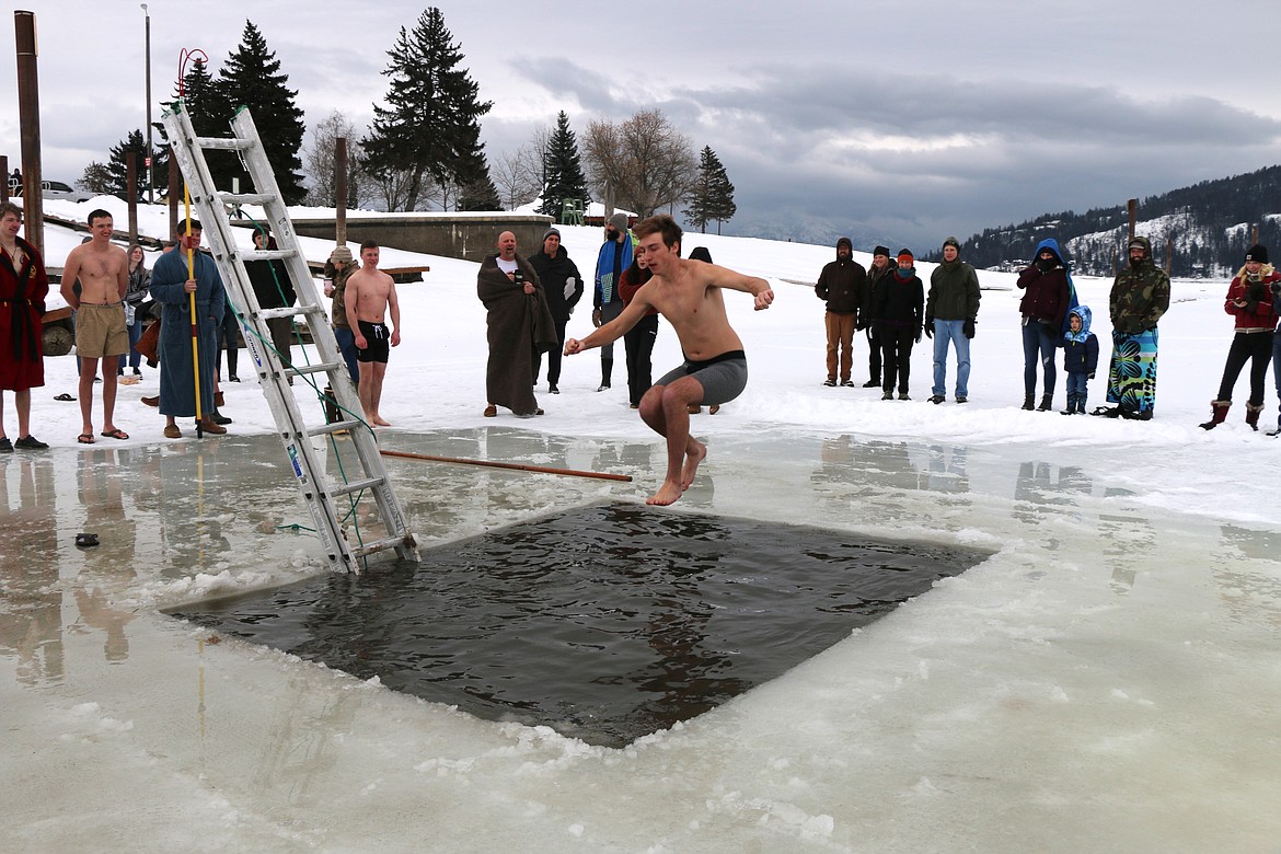 Neal Causey, a member of Boy Scout Troop 111, takes part in the troop's annual Polar Bear Plunge on Saturday. Several dozen scouts and family members took part in the event.