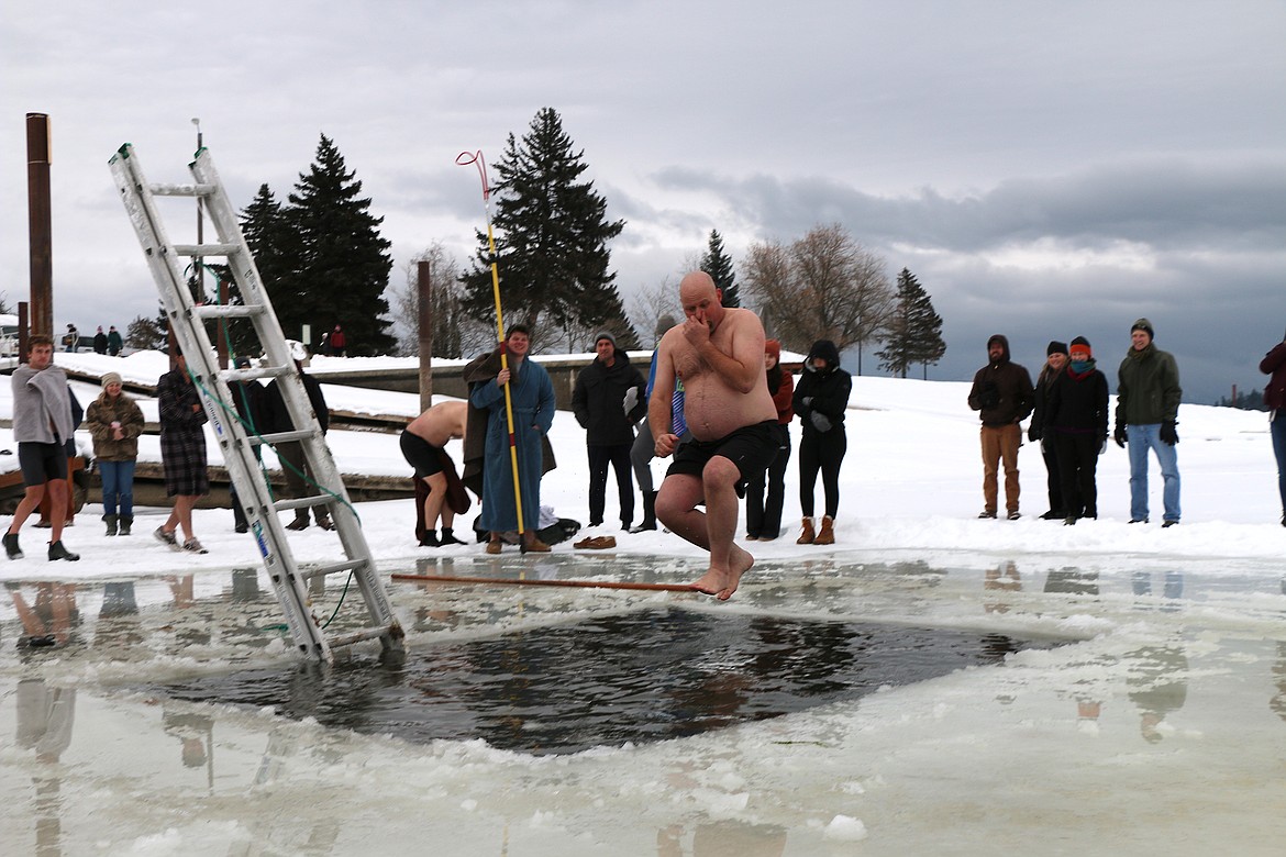 Boy Scout Troop 111 Scoutmaster Phil Voelz jumps into the freezing waters of Lake Pend Oreille during the troop's annual Polar Bear Plunge.