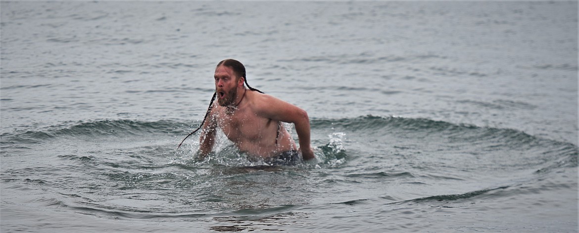 Michael Umphrey comes up for air after submerging himself in the Flathead River. (Scot Heisel/Lake County Leader)