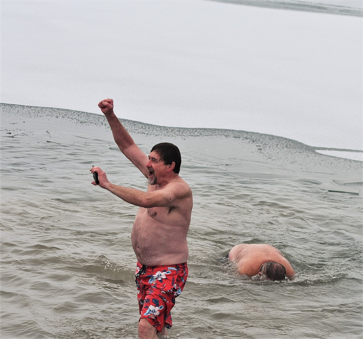 Dave Bull celebrates another plunge. He's been participating in the Riverside Park event since 1999. (Scot Heisel/Lake County Leader)
