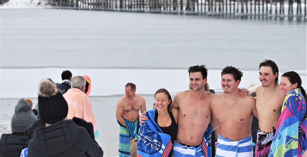 Participants pose for a chill group photo after the plunge. (Scot Heisel/Lake County Leader)