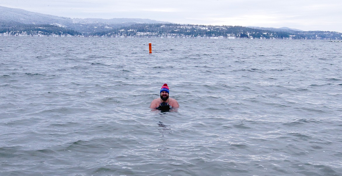 Rob Root lingers in Lake Coeur d'Alene long after everyone else in the Polar Bear Plunge left the water on Saturday.